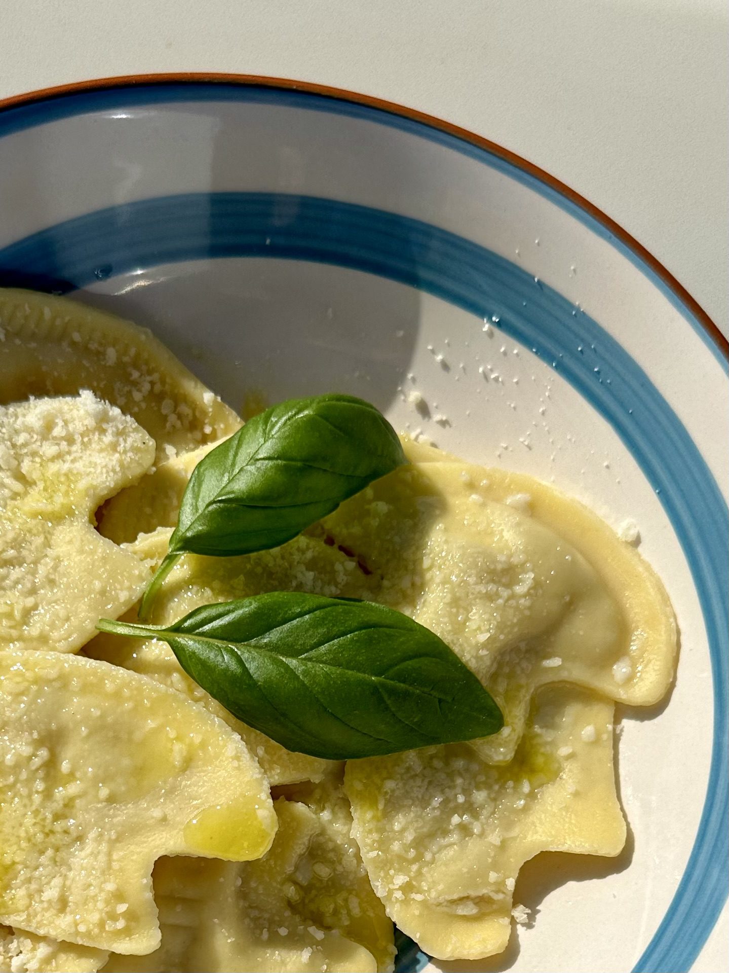 A plate of delicious pasta with our olive oil and some parmazan